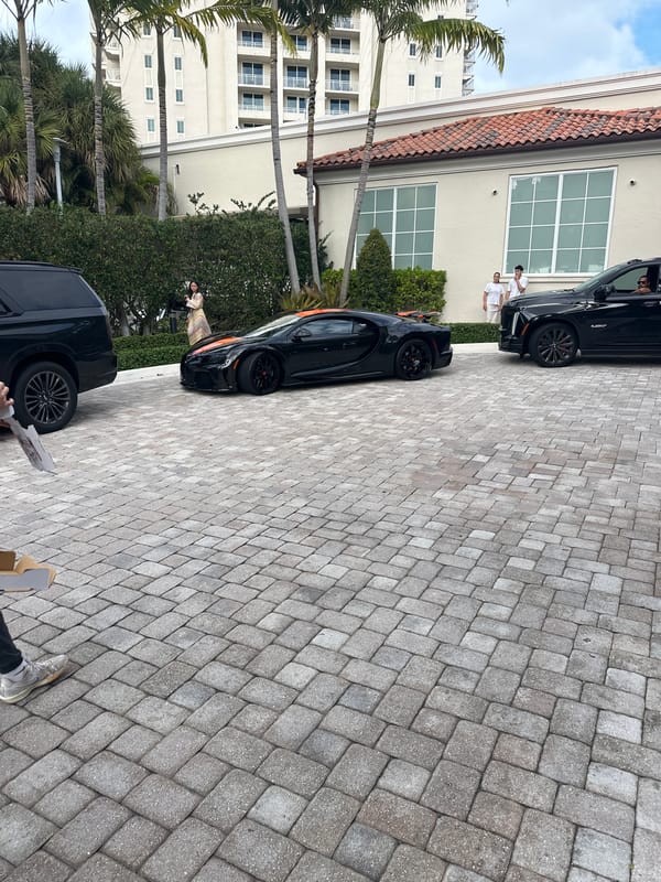 Luxury vehicles including Bugatti spotted in Aventura driveway