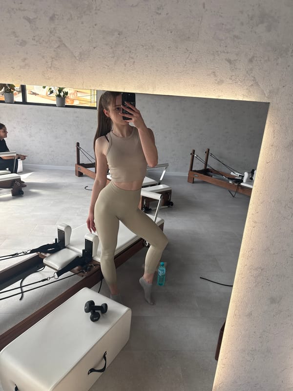 Woman Takes Mirror Selfie at Sofia Pilates Studio