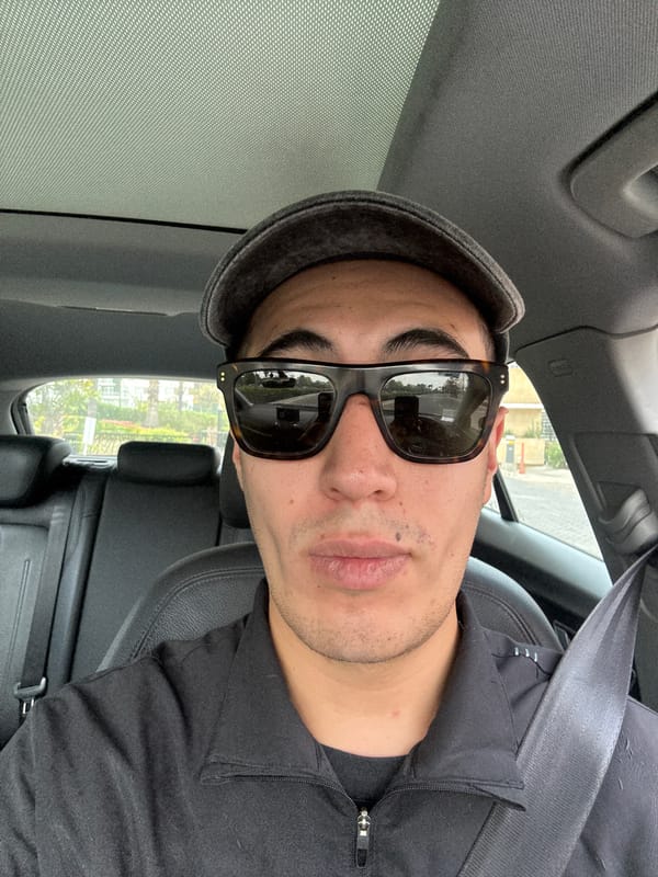 Self-portrait taken inside car in Mexican town