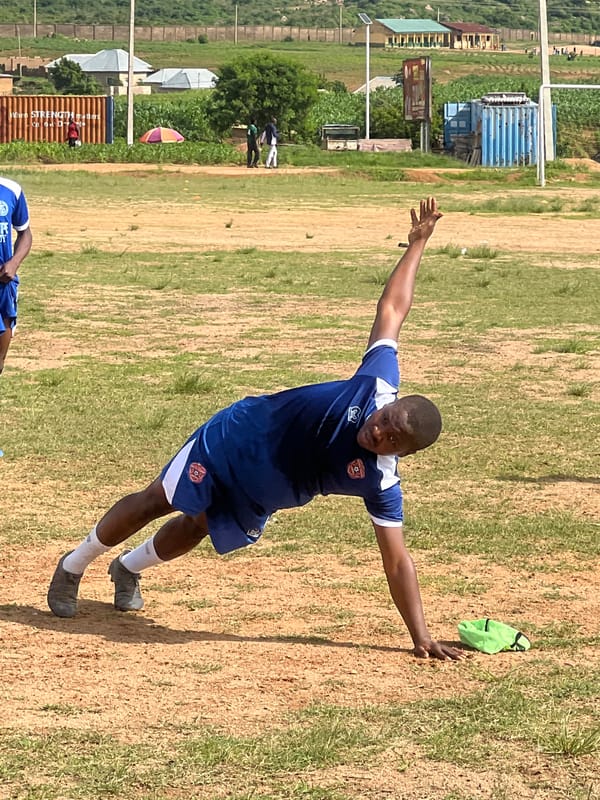 New Hope Academy soccer training on a dusty Jos field