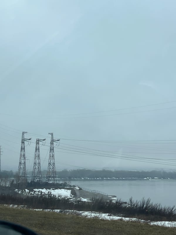 Overcast morning scene with power towers near Kama River
