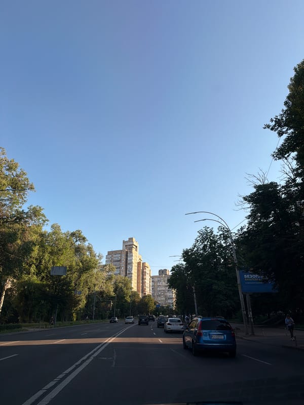 Busy boulevard cuts through Kyiv on a clear afternoon