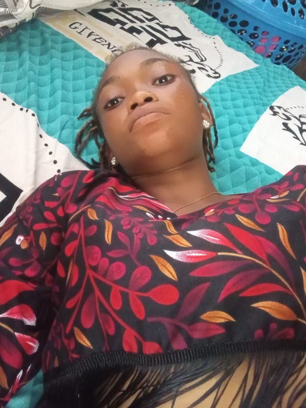 Woman takes multiple selfie portraits in Shagamu, Nigeria