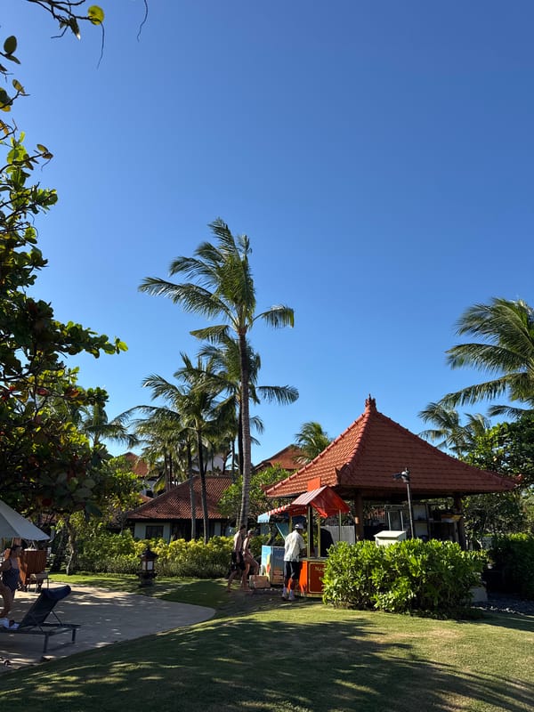 Morning beach preparations and family activity in Kuta Selatan