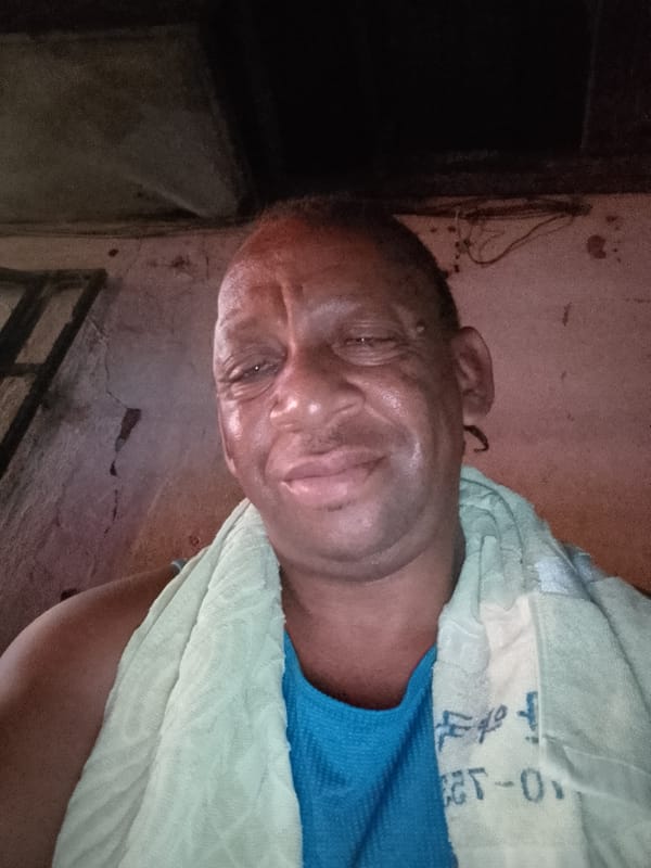 Man takes indoor selfies in Sabon Tasha, Nigeria