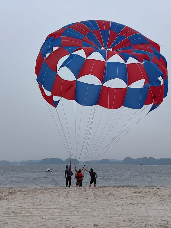 Tourists enjoy beach activities at Bai Chay Ward, Vietnam