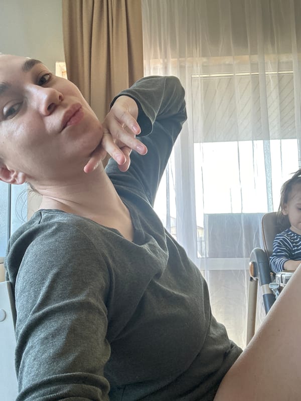 Woman takes selfies with child in Kharnavy, Russia