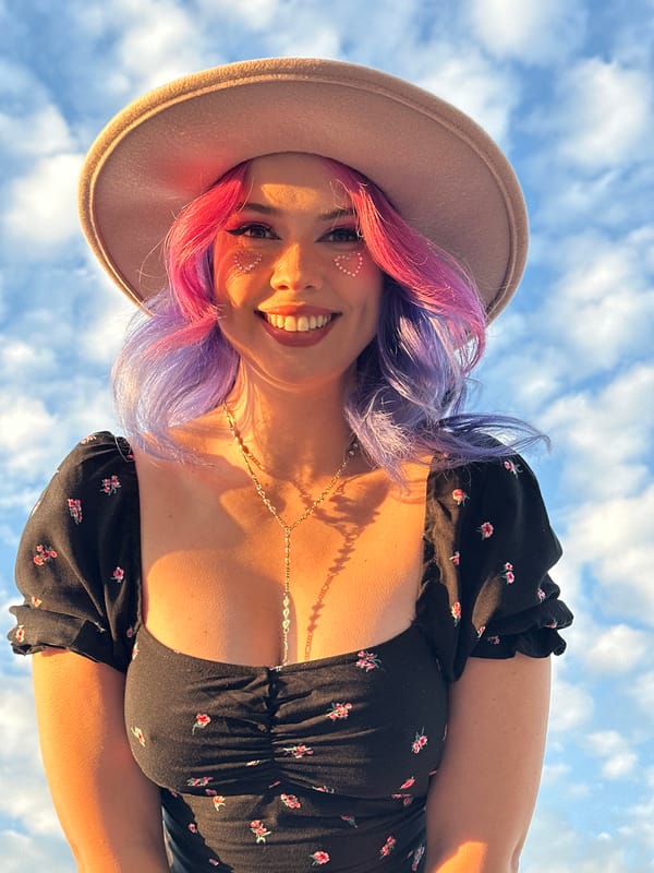 Woman photographed smiling outdoors in Zagreb during golden hour