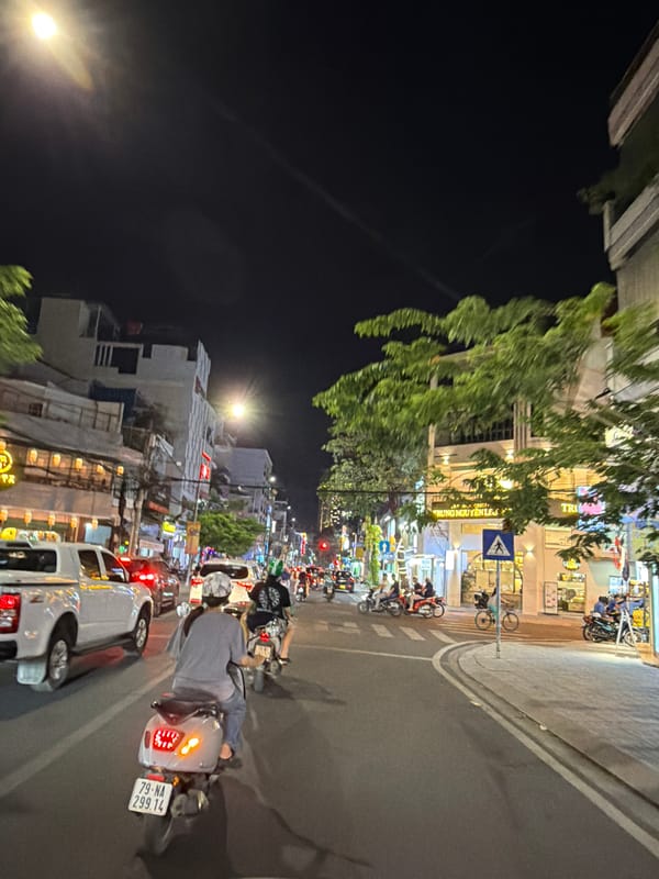 Nha Trang commercial streets at night, traffic and storefronts