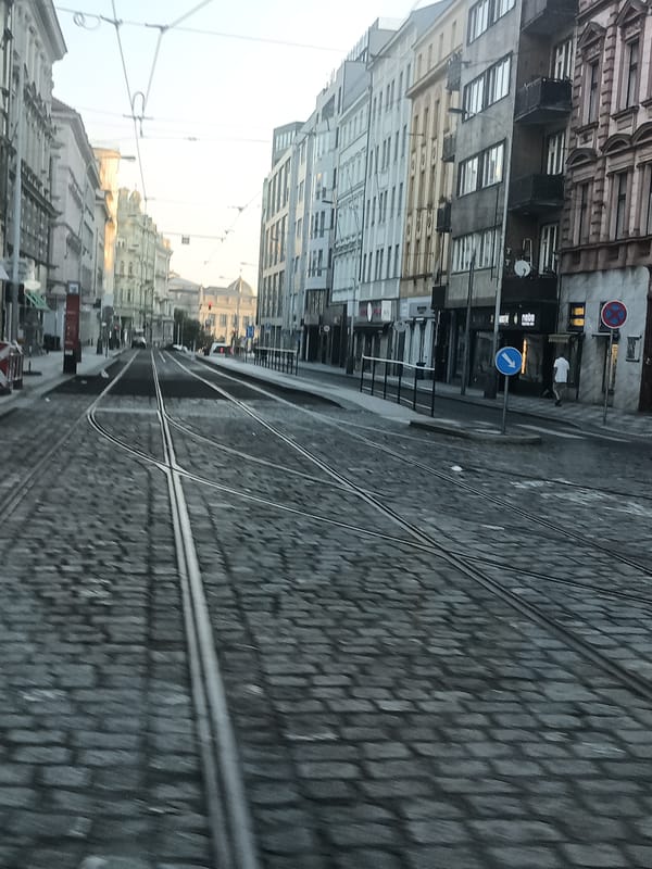 Moving through Prague's tram streets on a summer morning