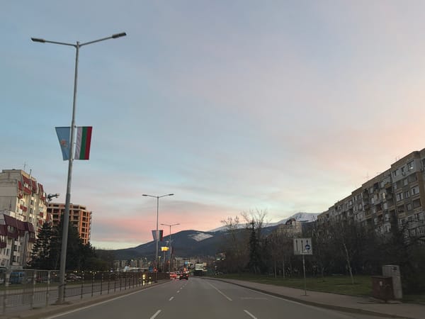 Evening traffic scene captured on Sofia street at dusk