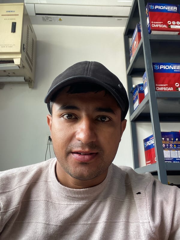Man photographed with Pioneer brand boxes in Bukhara warehouse