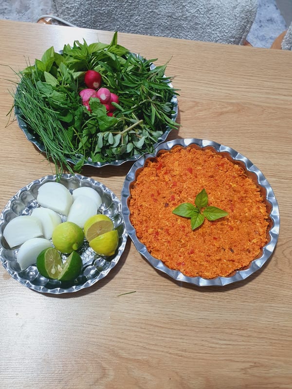 Evening meal preparation documented alongside rocky landscape in Kheyrabad