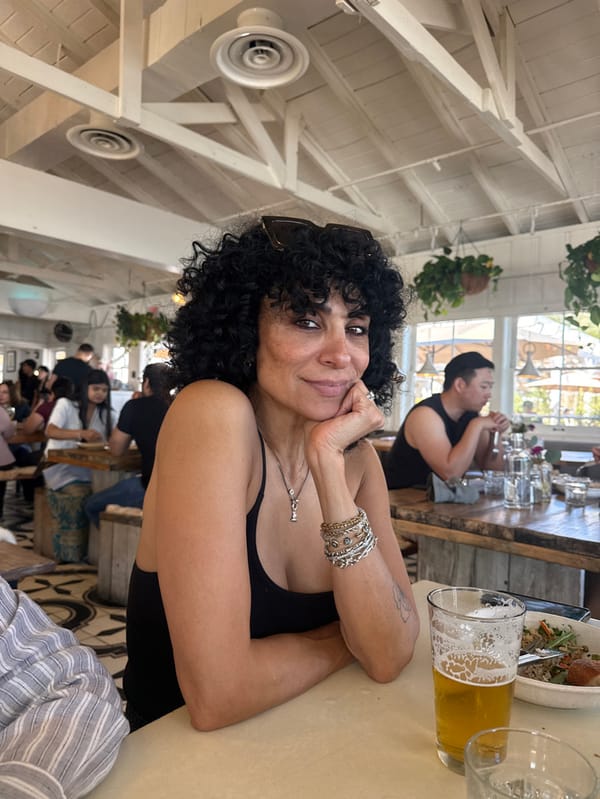 Woman celebrates birthday with cake at Malibu Pier restaurant