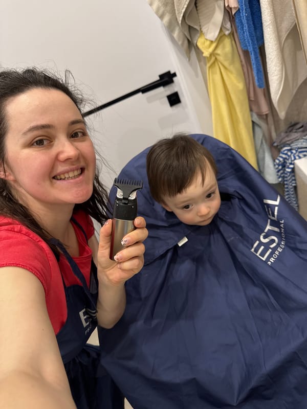 Family haircut session documented in Izhevsk home