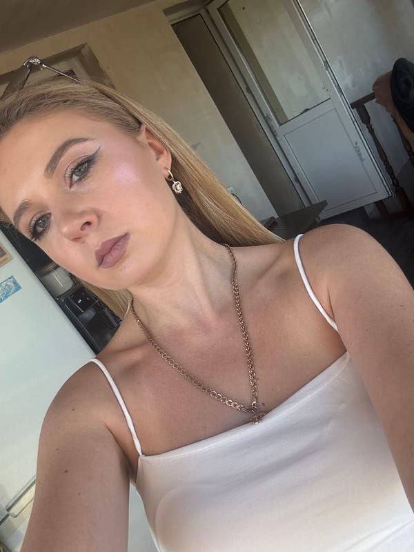 Indoor selfie session with a cat nap in the background