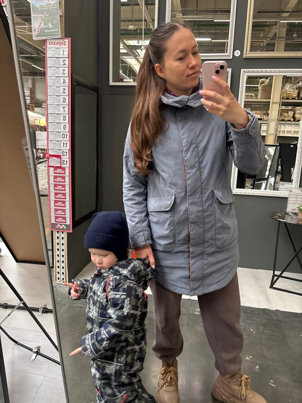 Mother and child take selfie while shopping in Perm store