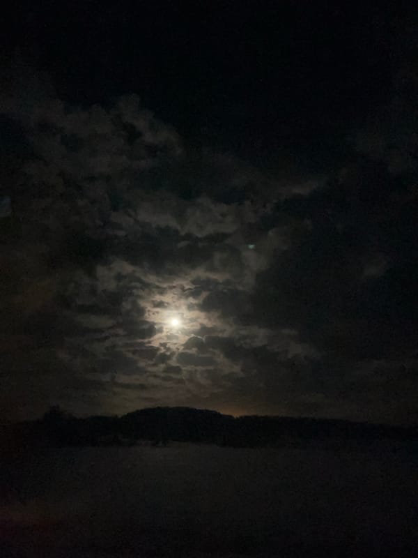 Cloudy moonlit night observed in Niva, Russia