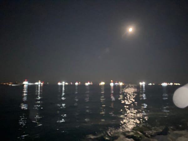 Ships and moonlight on the Istanbul waterfront at night