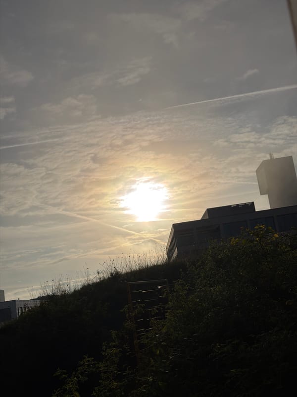 Morning sun breaks through clouds over Leudelange, Luxembourg
