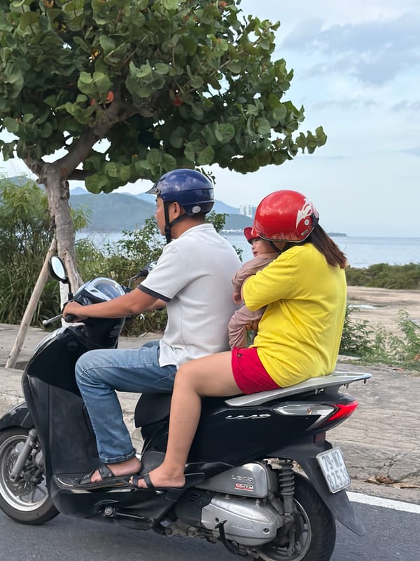 Scooters and street life along Nha Trang's coastal road