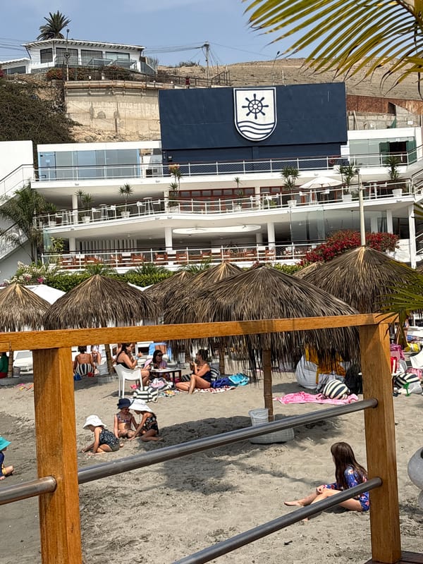 Evening beach scene with people relaxing in Ancón, Peru