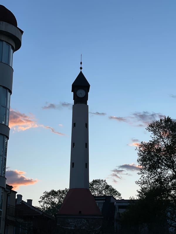Clock tower observed under dramatic skies in Pazardzhik, Bulgaria