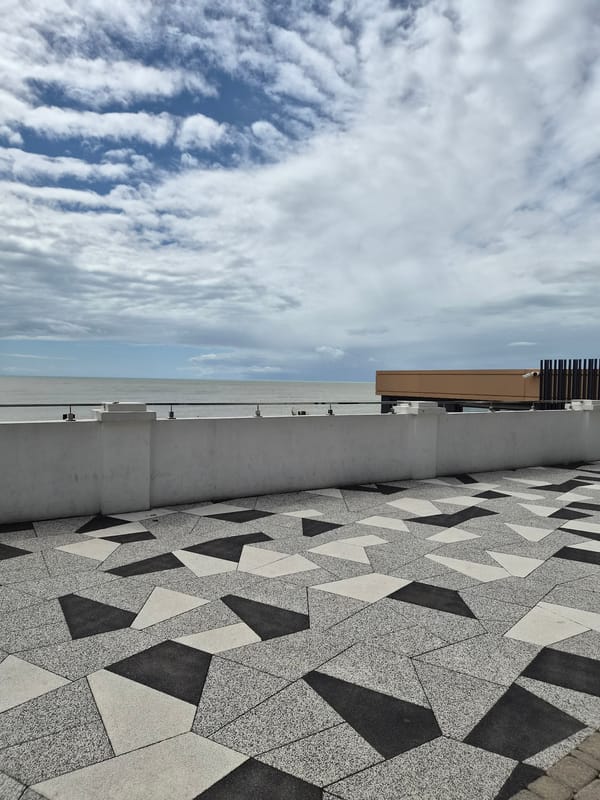 Tourist documents Sochi landmarks and coastal areas during morning walk