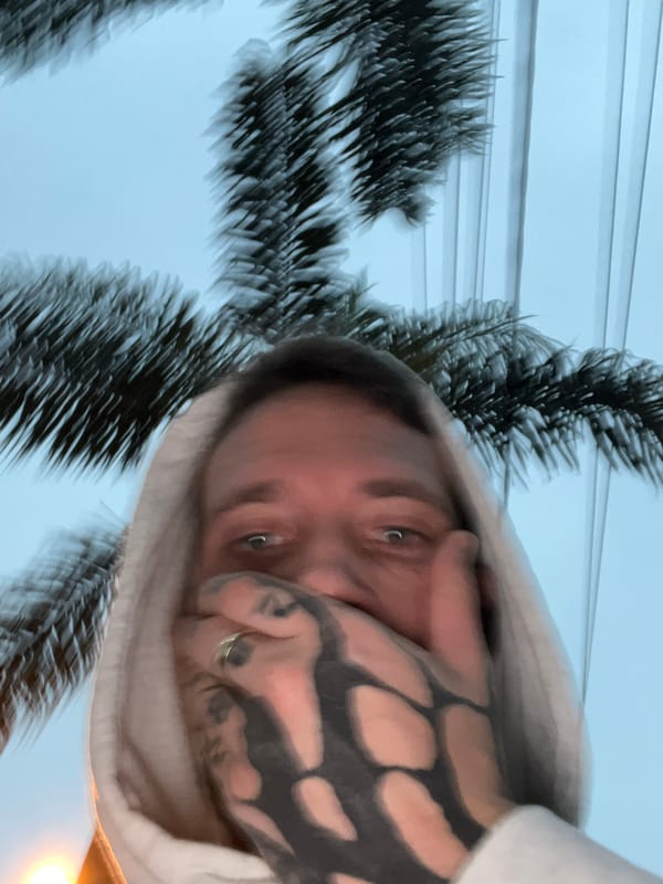 Tattooed individual takes selfie outdoors in Cordoba, Argentina