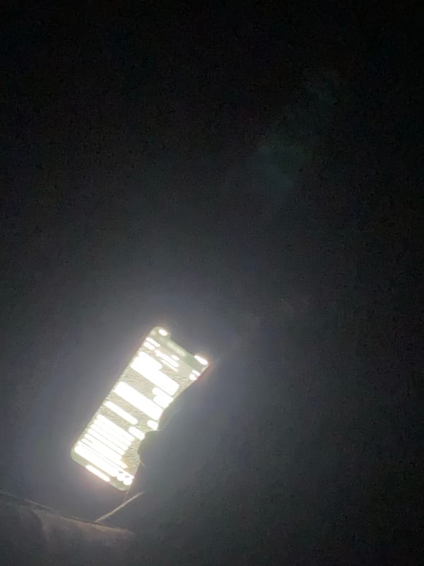 Cell phone screen displays grid pattern outdoors in Lokoja
