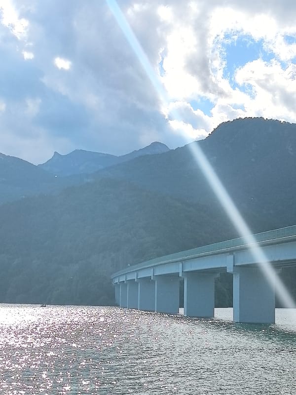 Sunlit bridge over Boadella reservoir captured in Cercs, Spain