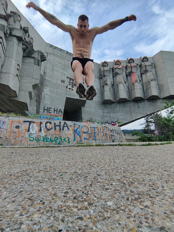 Parkour athlete performs jumps at Varna monument