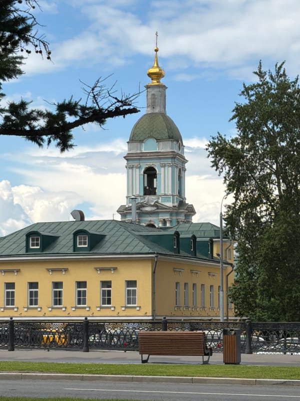 Woman documents casual walking tour of Podolsk landmarks