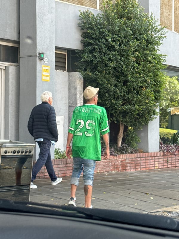 Man in green jersey spotted on Buenos Aires sidewalk