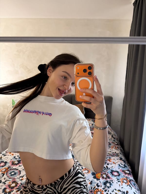Woman takes mirror selfies in Pernik, Bulgaria