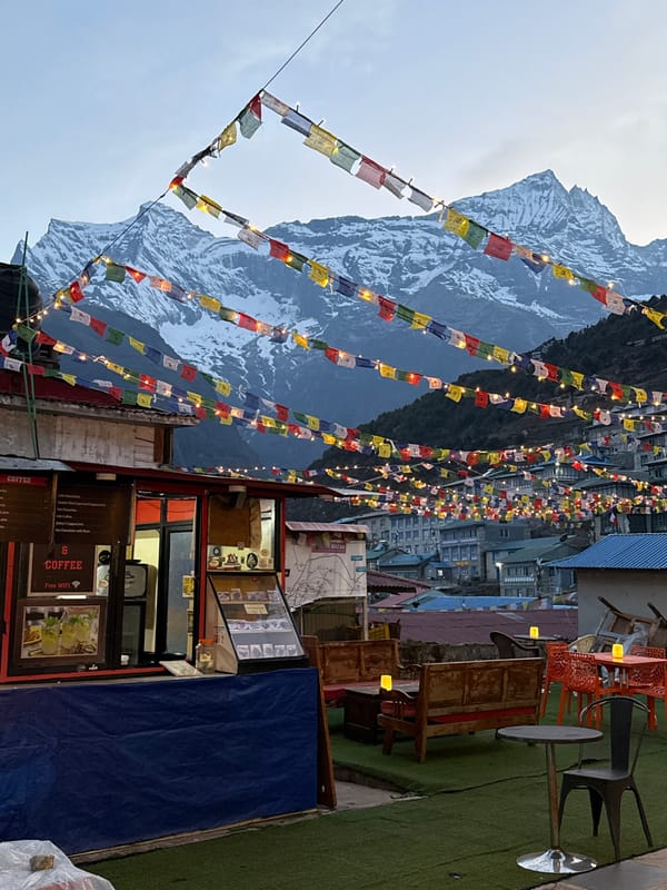 Mountain café captured in Namche Nepal amid snowy peaks
