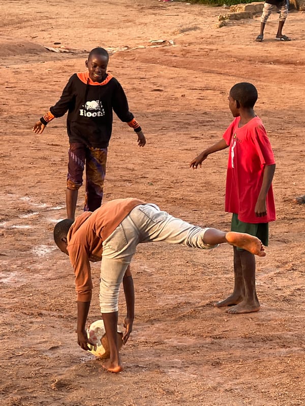 Pickup soccer on Jos's rocky fields at golden hour