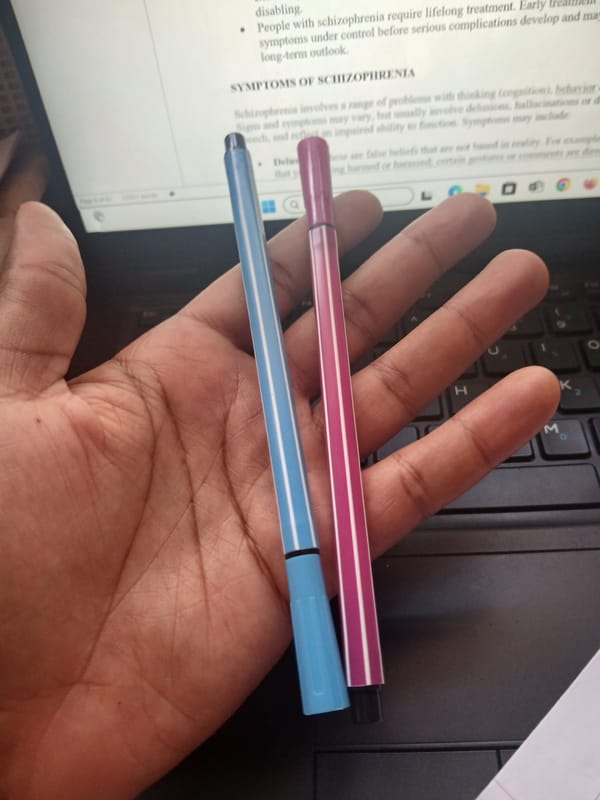 Person uses laptop with pens, hair product in Kenya