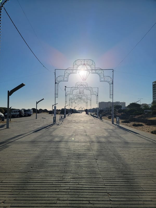 Quarteira promenade: statues, street food, and sunshine
