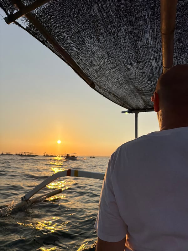 Boats on the water at golden hour near Lovina Beach
