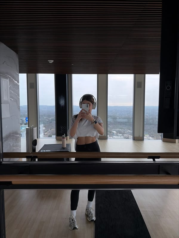 Woman photographs Austin skyline from high-rise apartment Friday evening