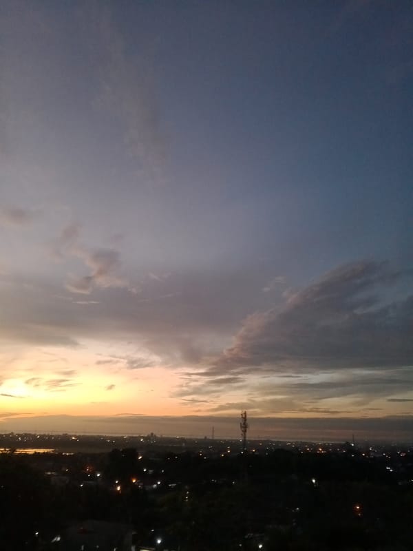 Dramatic sunset captured across Lhokseumawe, Indonesia during evening hours
