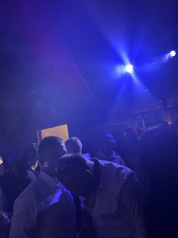 Group illuminated by bright blue light indoors in Bulgaria
