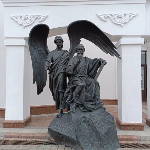 Bronze angel and seated man statue witnessed in Minsk