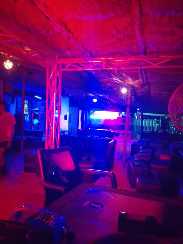 Colorful atmospheric lighting observed at indoor entertainment venue