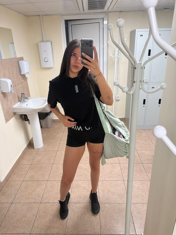 Woman takes multiple selfies in Gabrovo public restroom