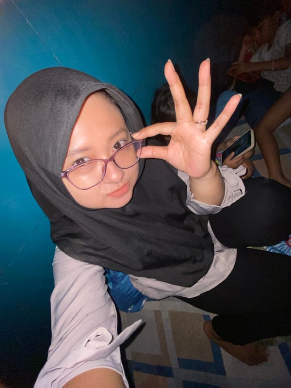 Woman documented in casual indoor moments in Gelam, Indonesia