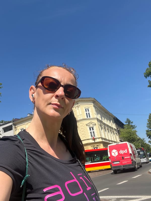 Woman documents sunny morning walk through city streets