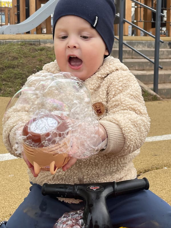 Child plays with bubbles in Izhevsk, Russia