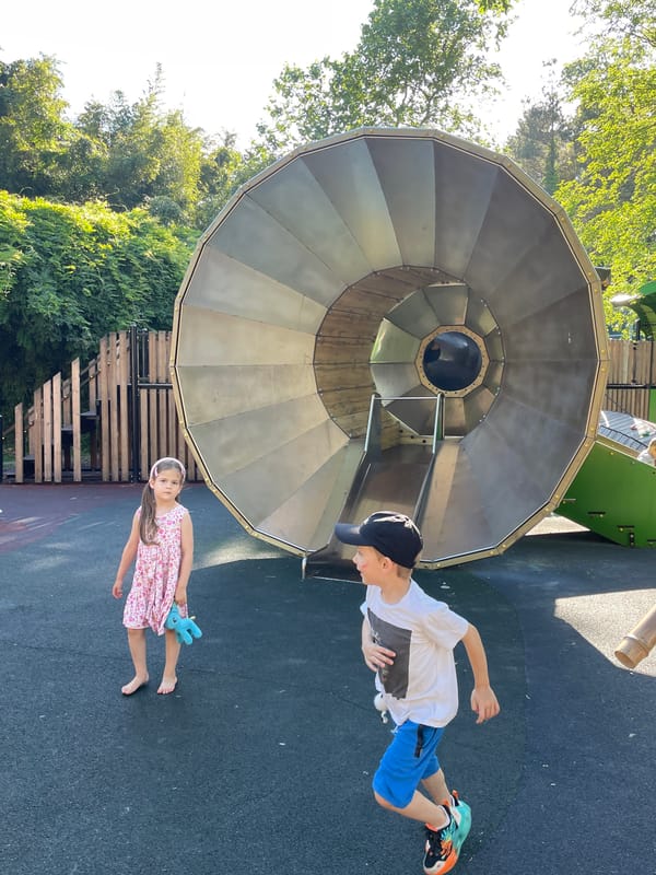 Family explores Sochi parks and playgrounds on summer afternoon
